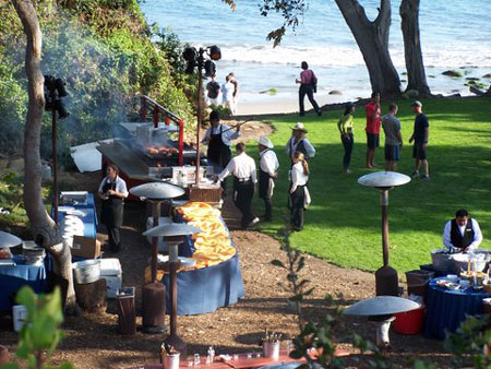 Setup of corporate event on a green lawn near the California coast.